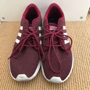 Maroon Adidas tennis shoes.